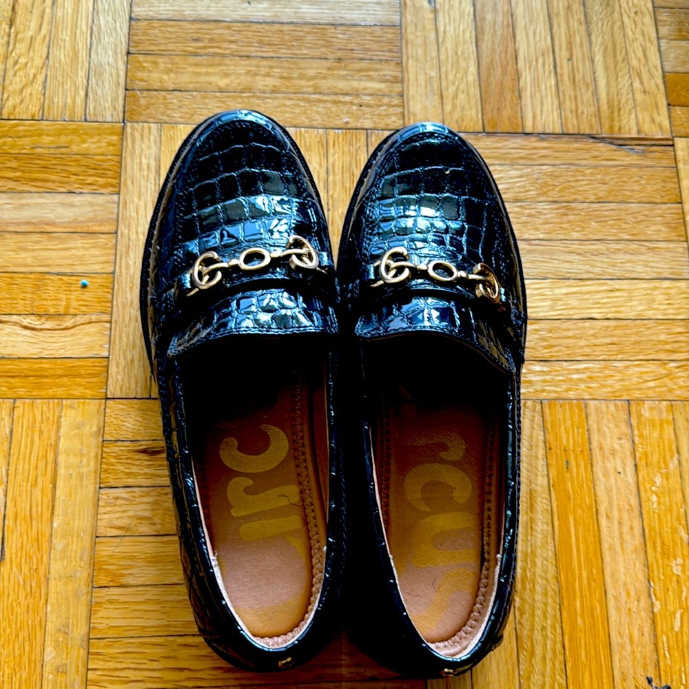 A pair of crocodile platform shoes